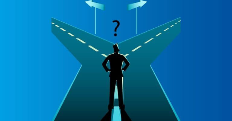 A man standing at a crossroads.