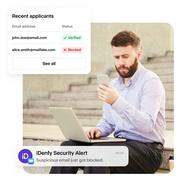 A person is reviewing the iDenfy security alert regarding a blocked user due to an invalid email address.